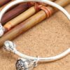 Vòng tay kiềng bạc, charm chuông gió